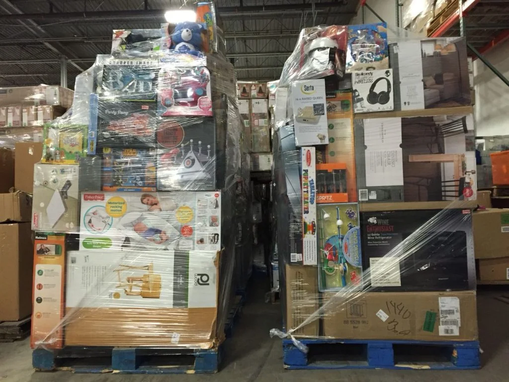 Warehouse with stacked Amazon return pallets